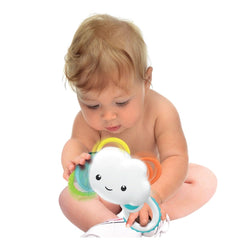 Baby Clementoni Rainy Cloud Rattle held by a smiling blonde baby with blurred facial features, showcasing soft materials and 