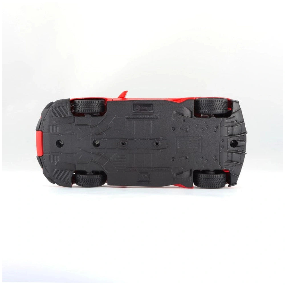 BBurago Ferrari 488 Pista 1:24 die cast vehicle in black with red accents, featuring holes, wheels, and a red button.