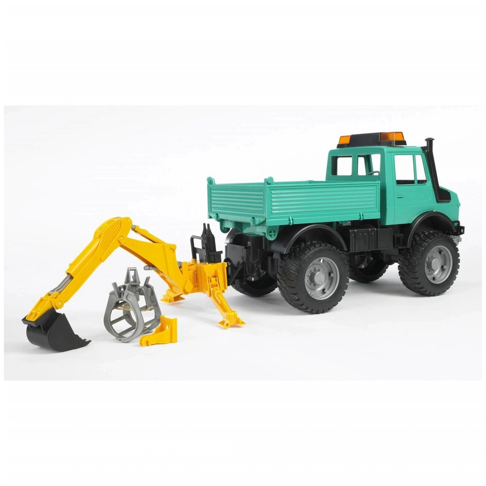 Green Bruder toy truck with yellow rear hydraulic arm and gray grabber, designed for realistic play.