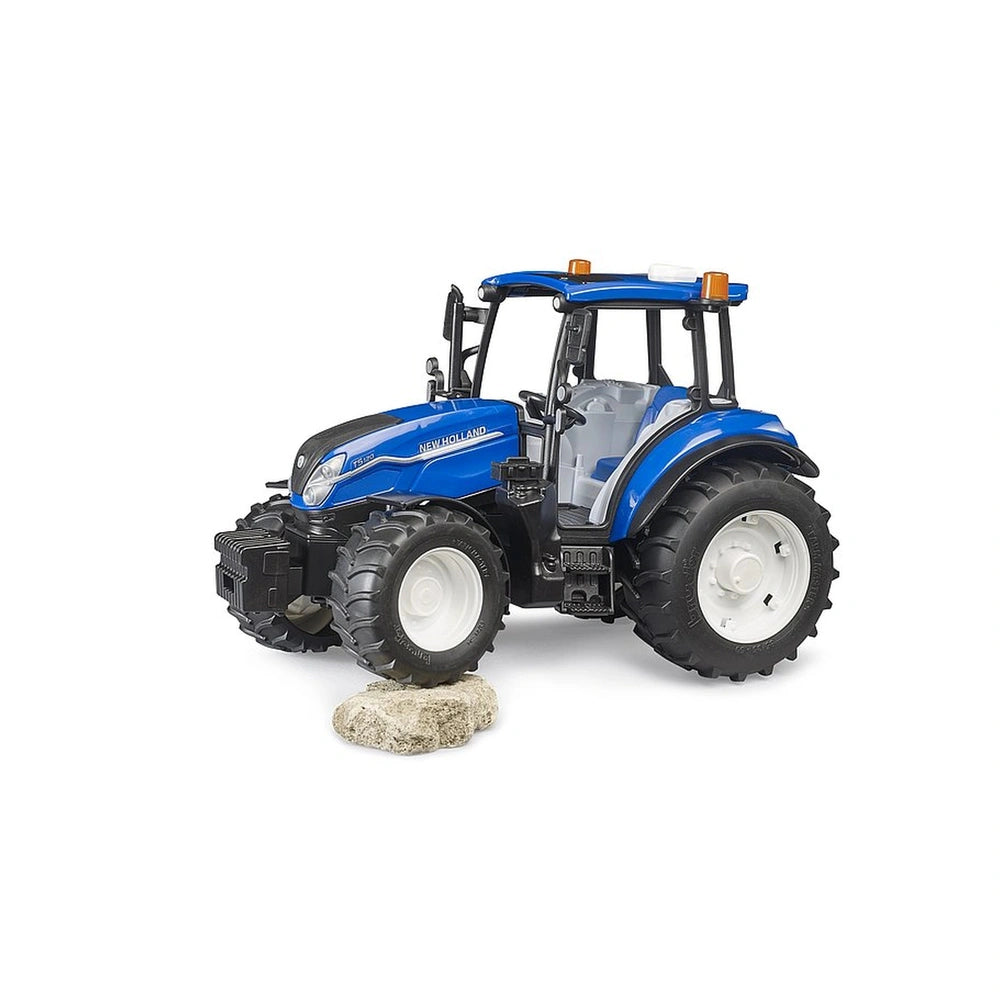 Blue New Holland T5.120 toy tractor on rocky terrain, featuring large black tires and detailed design.