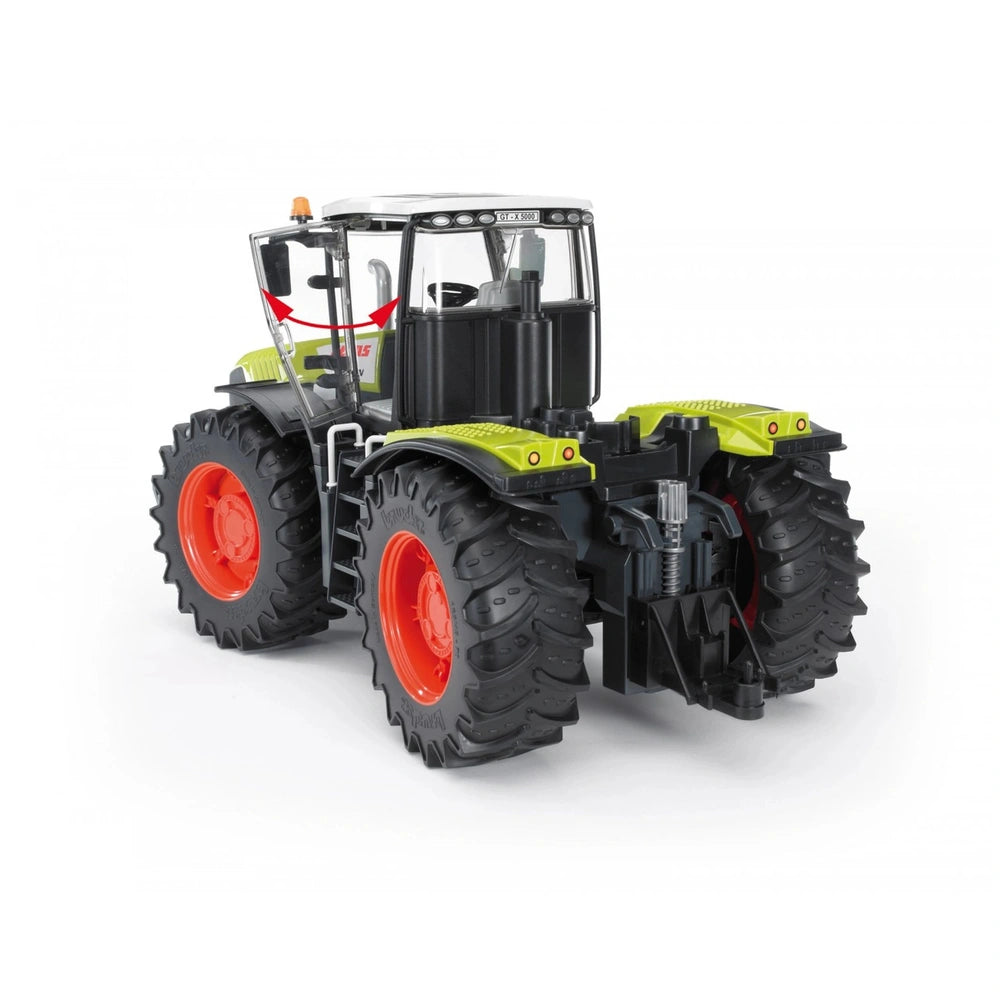 Green and black Bruder Claas Xerion 5000 toy tractor with large red wheels, rear view detailing rotating cab.