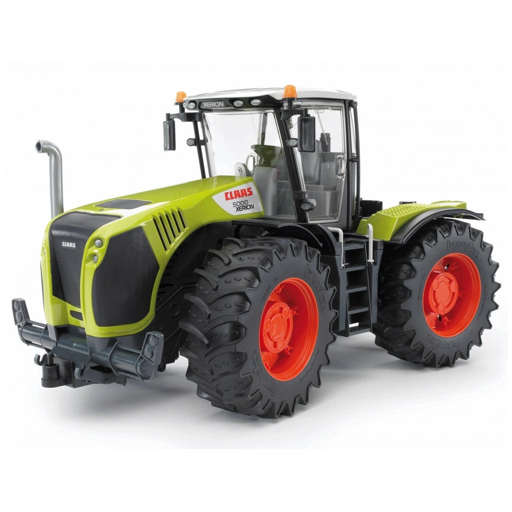 Bright green Bruder Claas Xerion 5000 toy tractor with red wheels and detailed design on a light background.