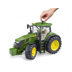 Green Bruder John Deere 7R 350 toy tractor with yellow wheels, detailed engine, hand lifting cab hatch.