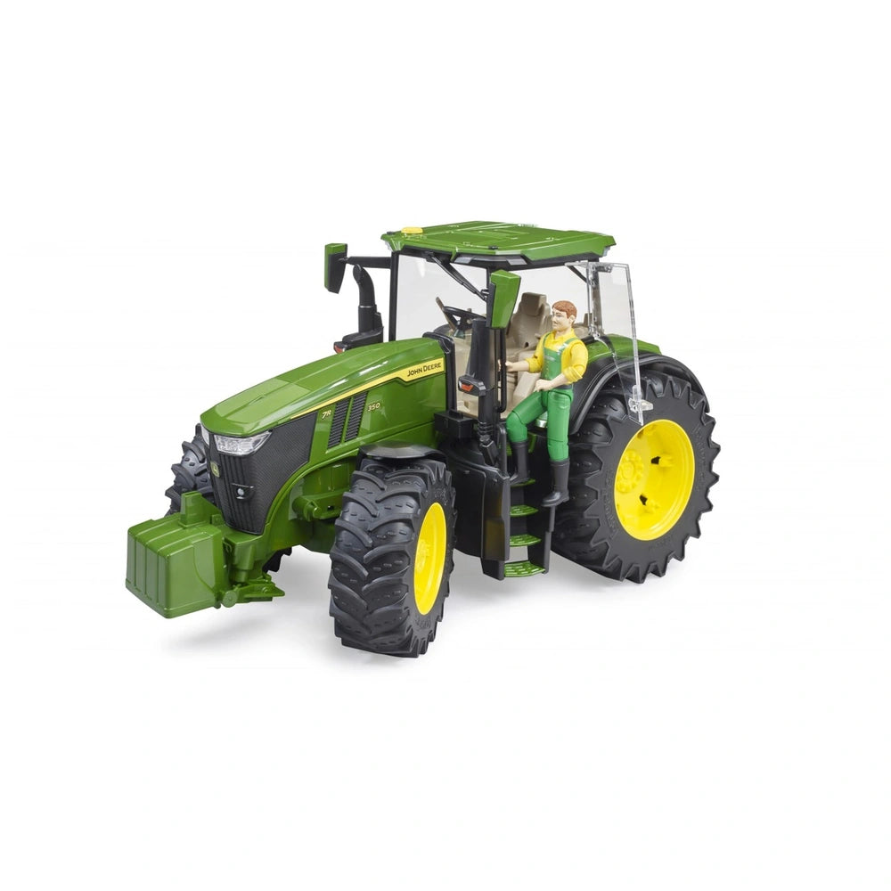 Green Bruder John Deere 7R 350 toy tractor with a farmer figure seated, featuring large black and yellow wheels.