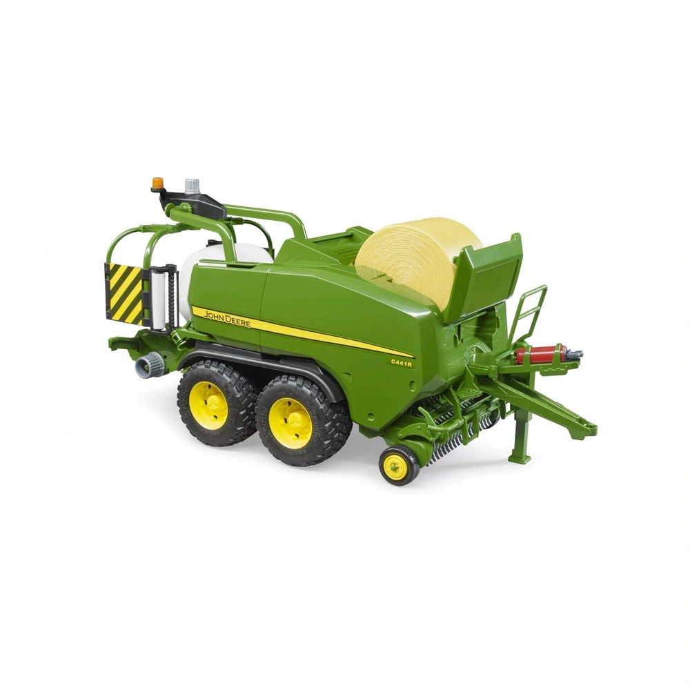 John Deere C441R toy baler in green and yellow, realistic details, with visible hay bale and four wheels.