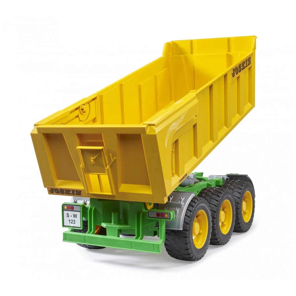 Yellow Bruder Joskin Tipping Trailer toy with raised bed, green chassis, and black wheels, showcasing realistic details.