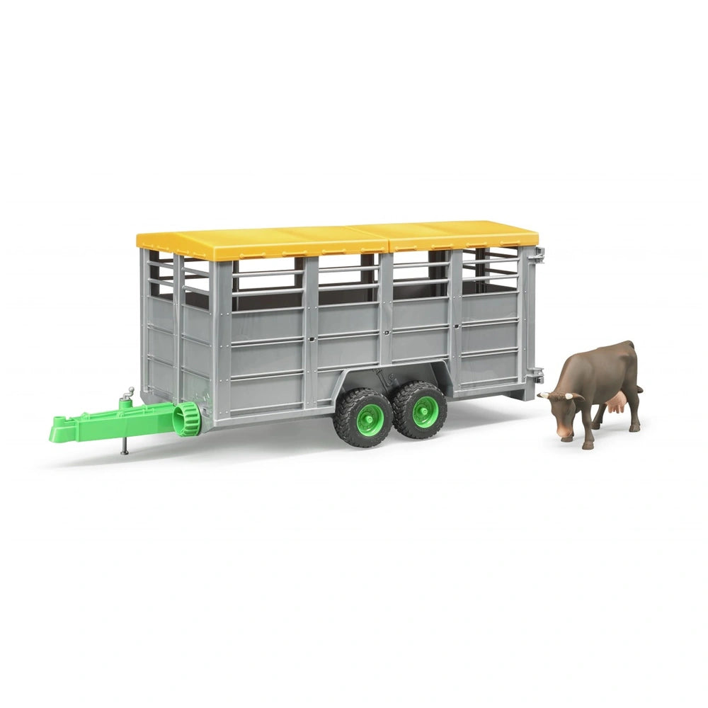 Gray livestock trailer with yellow roof and green hitch, includes a brown cow figure, designed for farm-themed play.