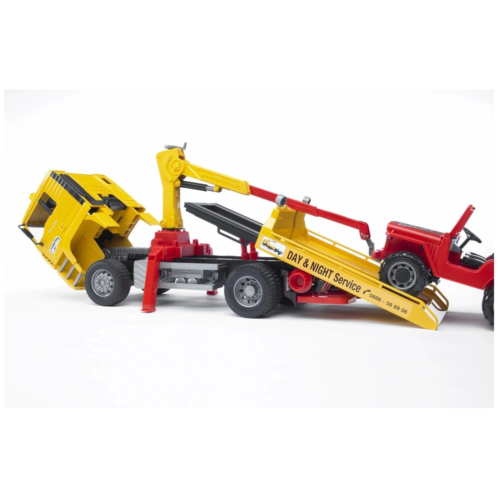 Yellow Breakdown truck with crane lifts a red vehicle for towing; features detailed "DAY & NIGHT Service" on its side.
