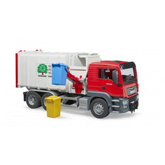 Red and white Bruder MAN TGS toy garbage truck with side-loading blue bin lifter and yellow recycling bin.