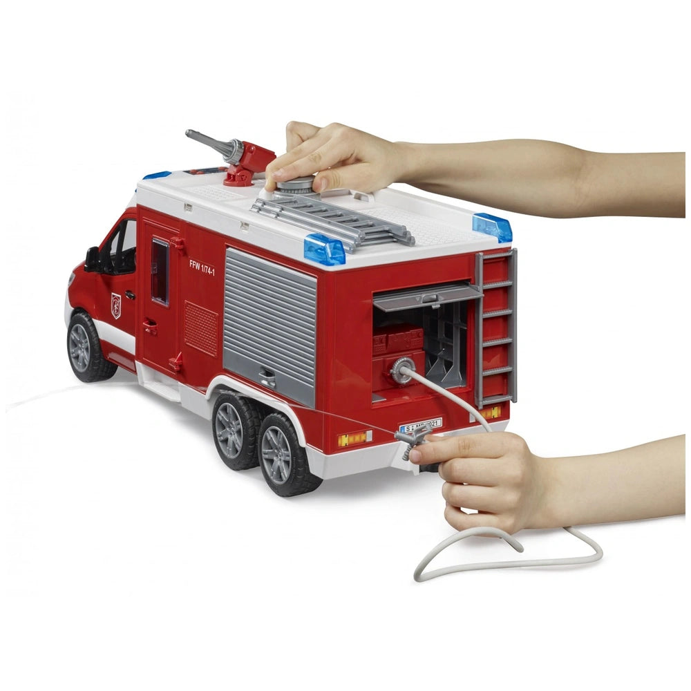 Hands interacting with a red toy fire truck, adjusting a hose and ladder on the Bruder MB Sprinter Fire Rescue Vehicle.