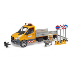 Orange and black Mercedes-Benz Sprinter toy with accessories, including traffic signs, pylons, wheelbarrow, and a road worker figure.