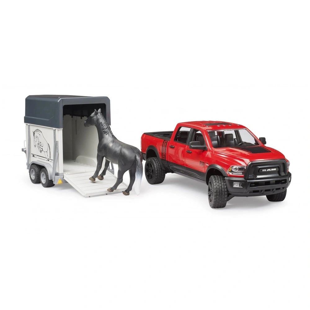 Red Bruder RAM 2500 toy truck with a horse trailer. A black horse is positioned on the trailer ramp.