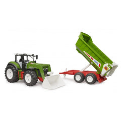 Green toy tractor with white front loader and a green rear tipper attached, shown on a white background.