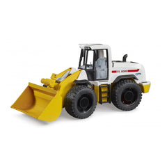 Bruder Roadmax Wheel Loader toy with large yellow bucket and black tread tires, side view.