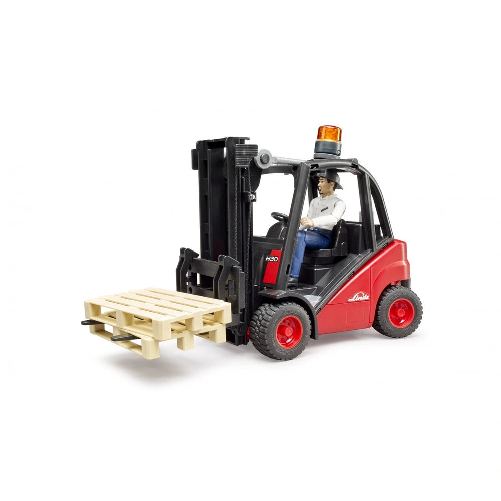 Red Bruder forklift toy with driver figure, holding a wooden pallet, featuring an orange rotating beacon light on top.