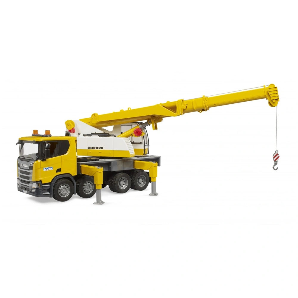 Yellow Bruder Scania crane truck model with extended telescopic arm and stabilizing feet, featuring realistic details.