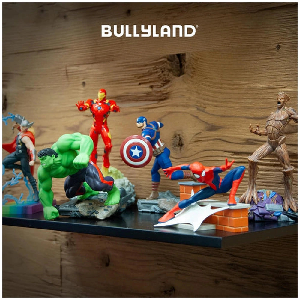 Bullyland Avengers Spider-Man action figure in various colors poses on a brown wooden surface with "BULLYLAND" text visible.