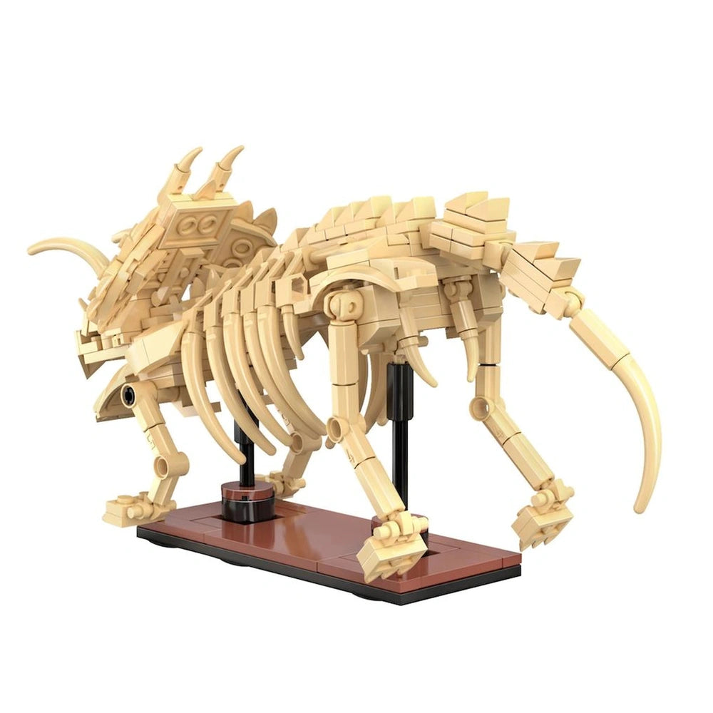 Cada Dinosaur Fossil Triceratops construction set features a light beige segmented figure with horns, claws, and a long tail 