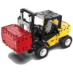 CaDA forklift truck construction set in red and yellow plastic with black wheels, tracks, and clear windows.
