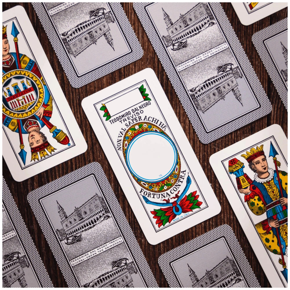 Dal Negro Trevisane Pro Cards N.114 in a red case, showcasing overlapping illustrated cards in red and blue on a gray backgro