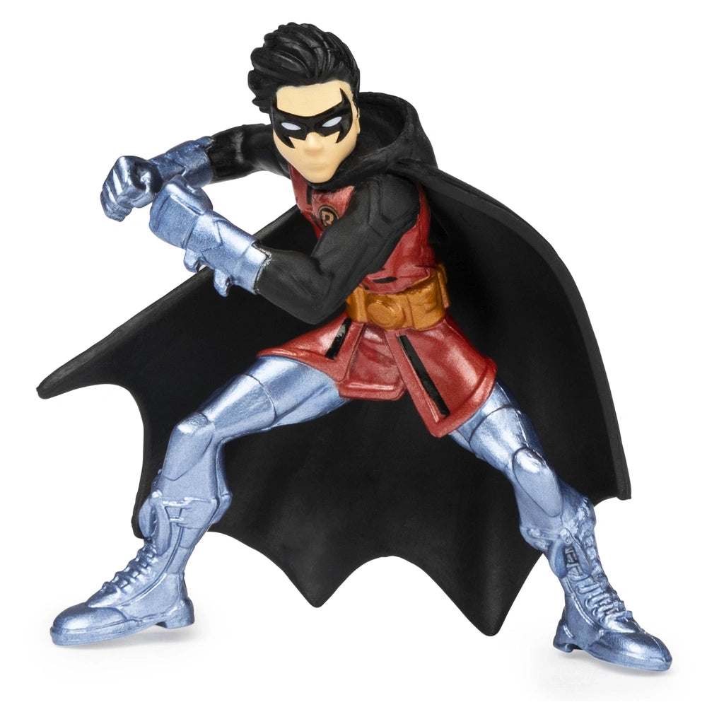 Batman collectible mini figure in a dynamic pose, featuring a red costume, black mask, and glossy finish against a white back