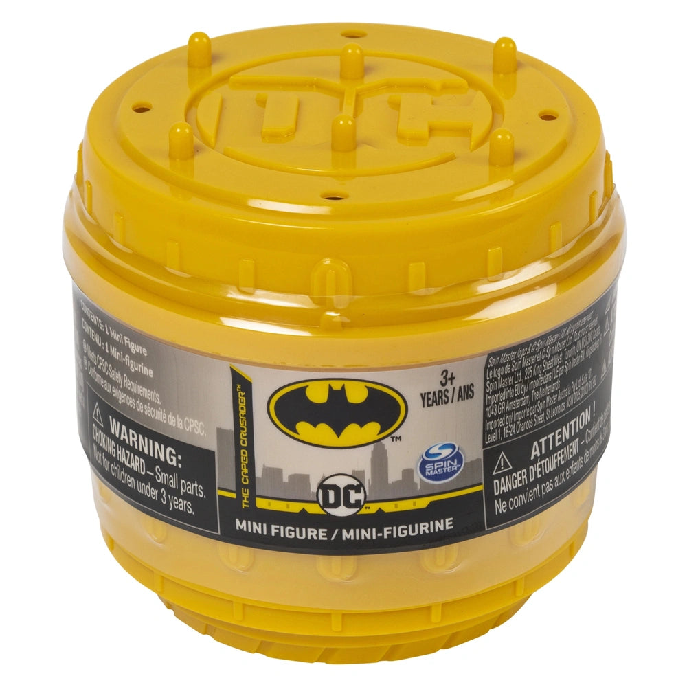 DC Comics BATMAN collectible blind box mini figure container features a yellow lid and black label with the Batman logo.