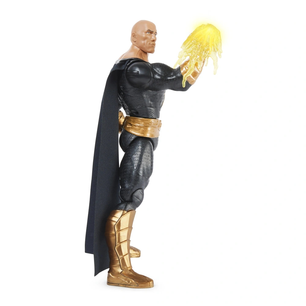 DC Comics Black Adam action figure stands confidently in a black and gold costume, holding a glowing yellow object.