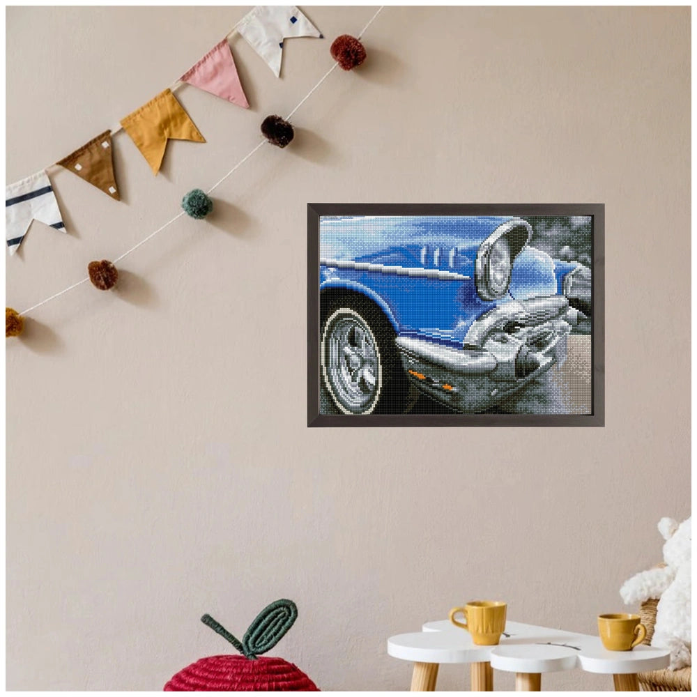 Diamond Dotz 50s Classic displayed on a white table with yellow cups, light beige wall, and a black television in background.