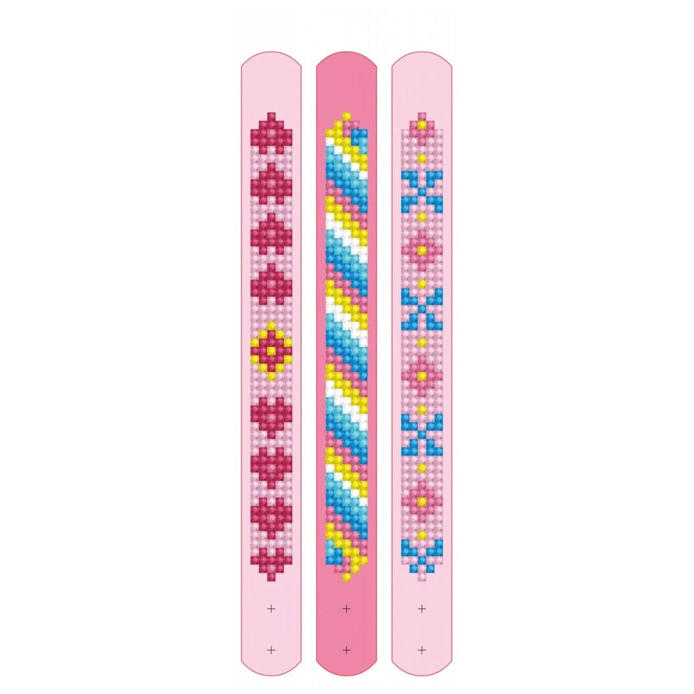 DIAMOND DOTZ Dotzies bracelets feature a pink base with blue, yellow, and red decorative bead patterns on a glossy top edge.