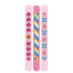 DIAMOND DOTZ Dotzies bracelets feature a pink base with blue, yellow, and red decorative bead patterns on a glossy top edge.