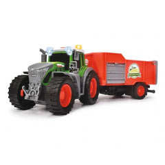 Fendt tractor with trailer in green and red plastic, featuring black rubber tires and clear plastic windows.