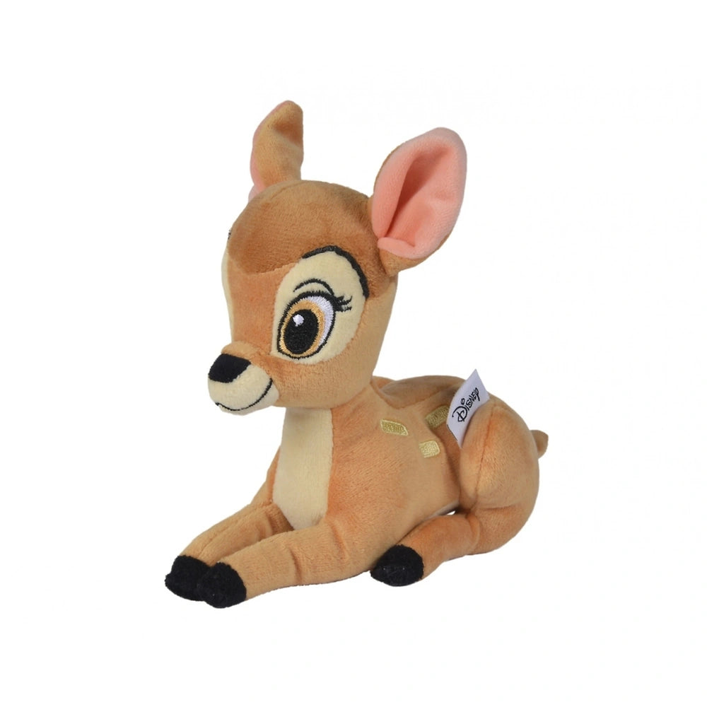 Plush deer toy in soft brown fabric with large eyes, a small nose, and a cuddly design, sitting upright against a white backg
