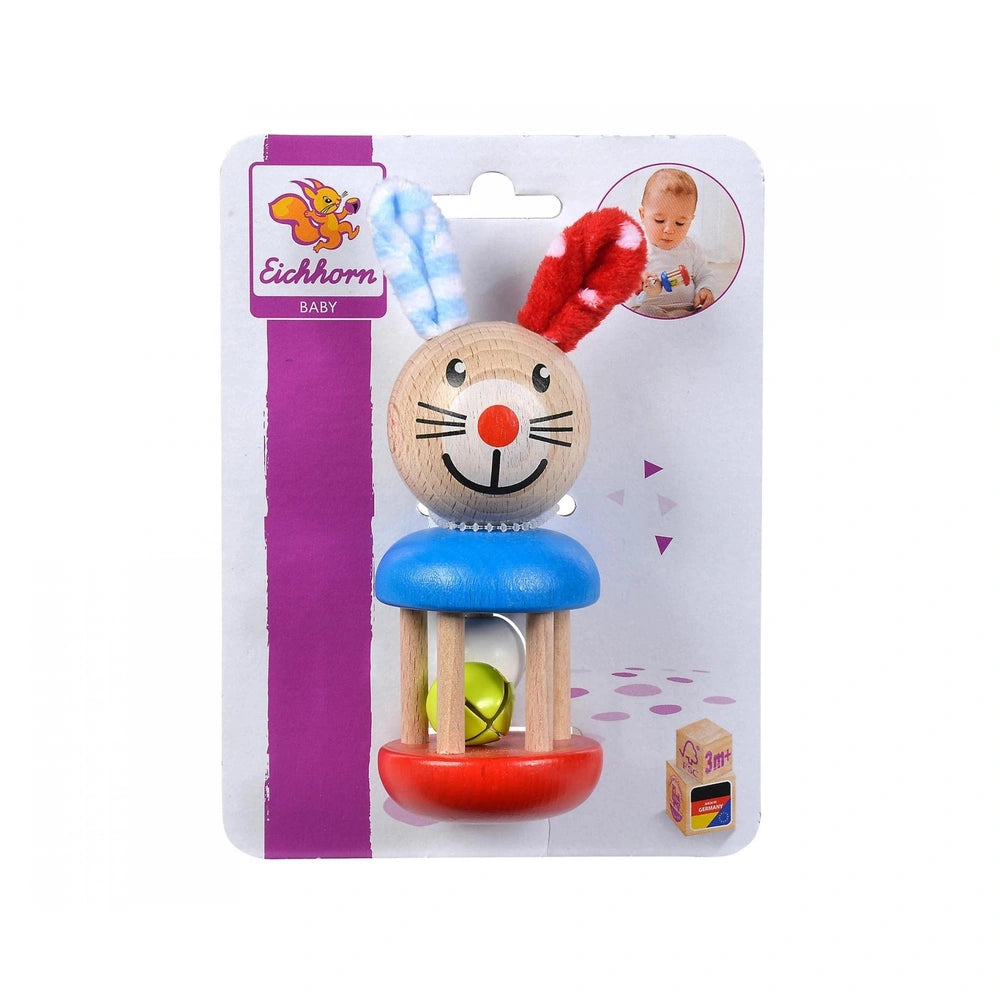 Eichhorn Baby Wooden Rattle Rabbit features a smiling wooden figure with a red nose, blue seat, and playful packaging design.
