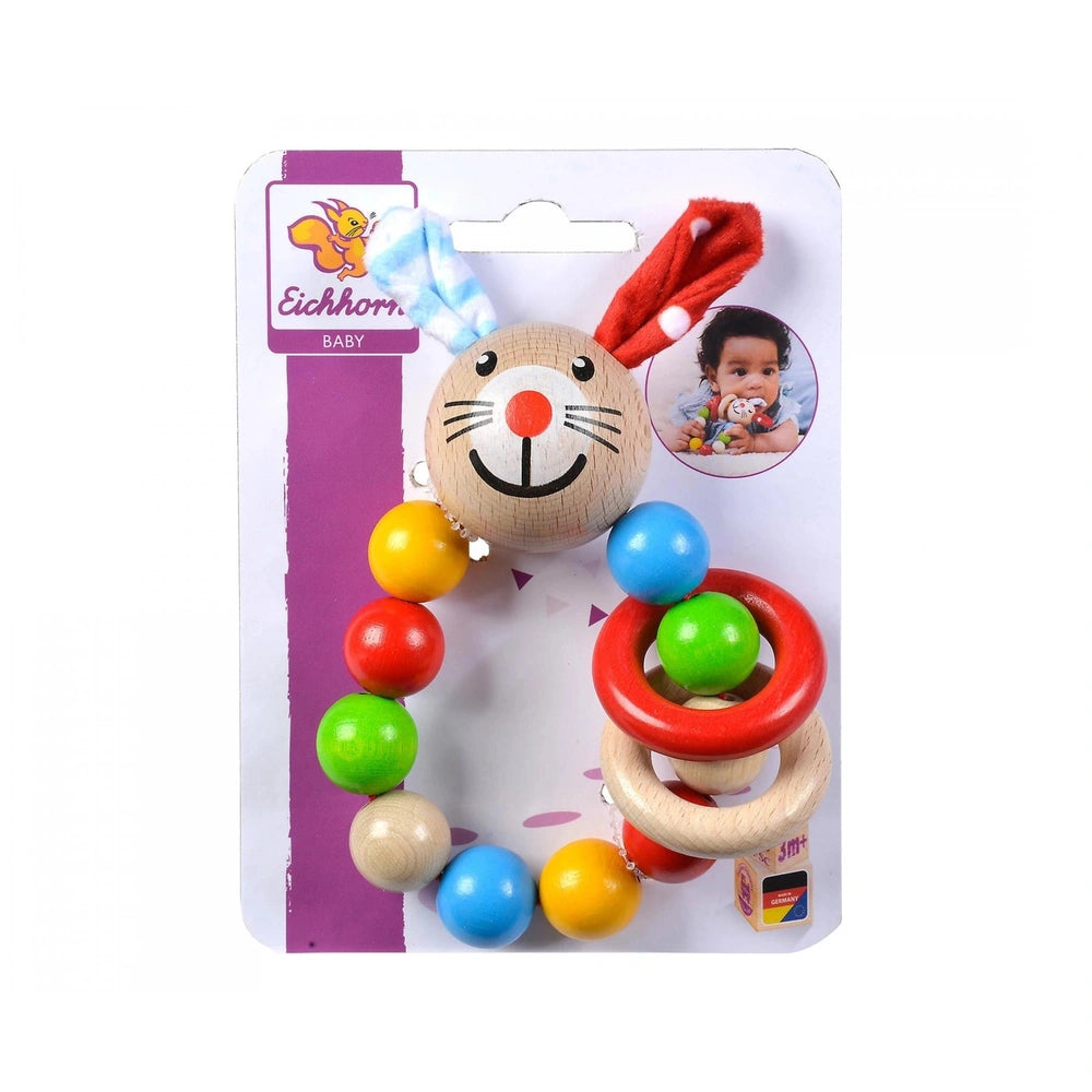 Baby wooden teething ring shaped like a rabbit, featuring colorful balls and vibrant packaging with a smiling cartoon design.