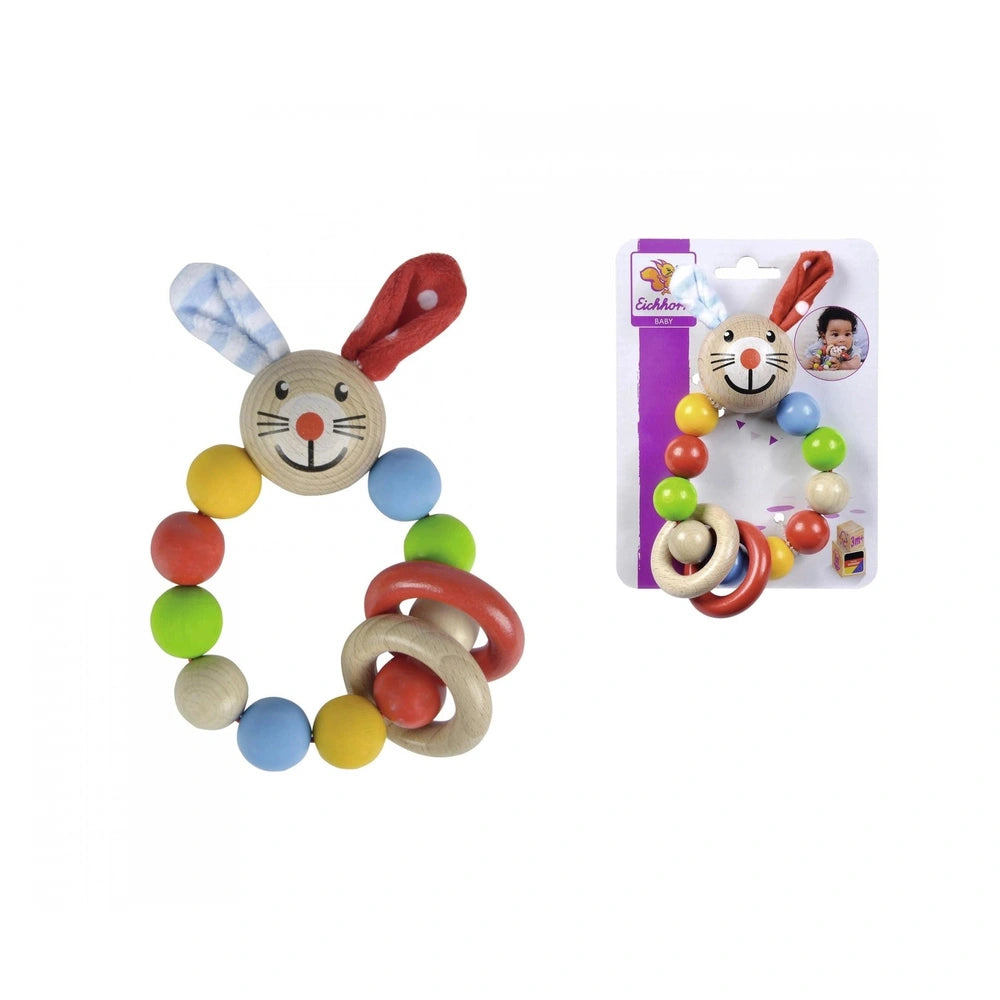 Baby wooden teething ring shaped like a bunny with a red bow, accompanied by colorful beads and packaged attractively.