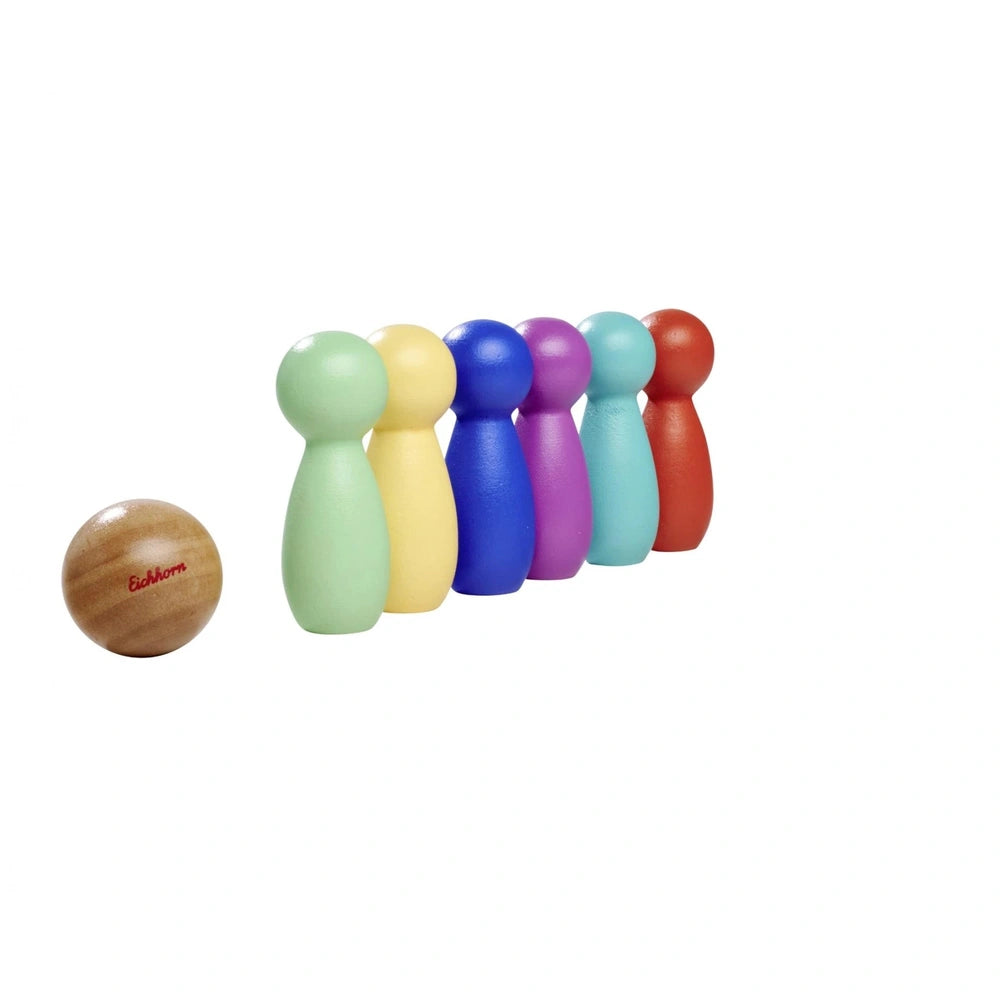 Wooden bowling game bumpers in various colors arranged in a straight line on a white background.