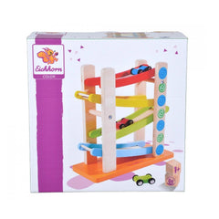 Colorful wooden motor-racing circuit toy set featuring a train and car, displayed in a box with a clear plastic window.