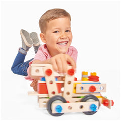 Eichhorn Constructor 4 in 1 construction set is being enjoyed by a smiling child in a pink shirt, playing with a colorful woo