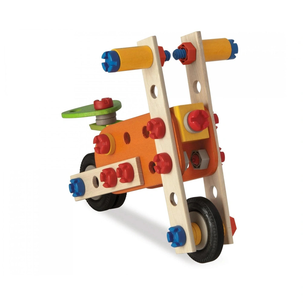 Eichhorn Constructor 4 in 1 construction set features wooden beams, colorful plastic wheels, and various assembly components.
