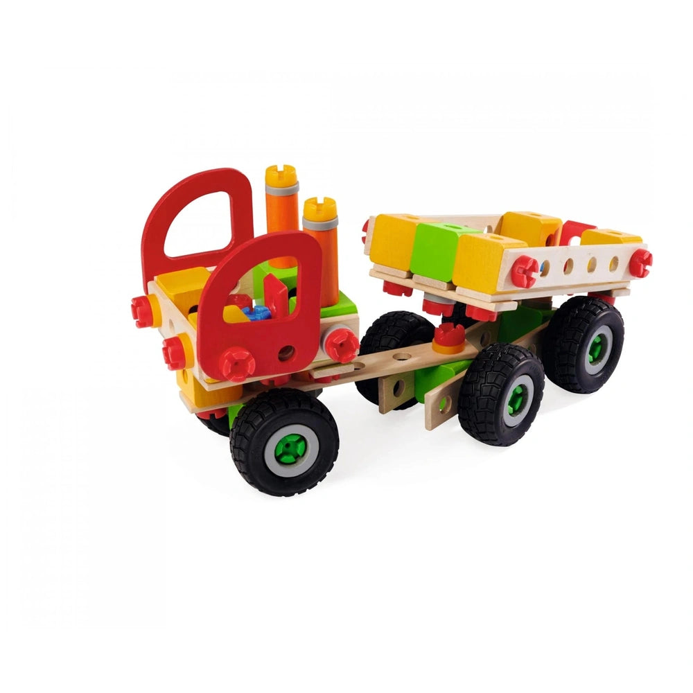 Eichhorn Constructor Truck in yellow, with red and green blocks and pegs, featuring black wheels and green axles.