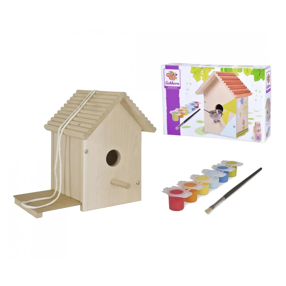 Eichhorn outdoor make your own birdhouse kit with colorful crafting materials and a paintbrush on a white background.