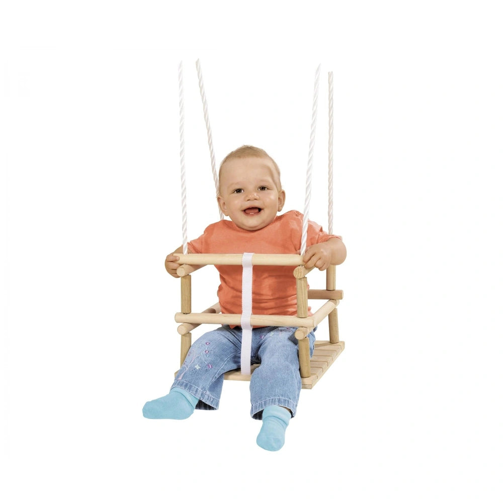 Eichhorn Outdoor Wooden Baby Swing: A smiling child in a wooden swing with a bright orange shirt against a plain white backgr