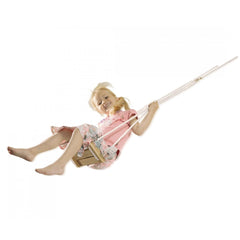 Eichhorn Outdoor Wooden Swing featuring a smiling girl in a pink dress, playfully suspended in mid-air, enjoying outdoor fun.