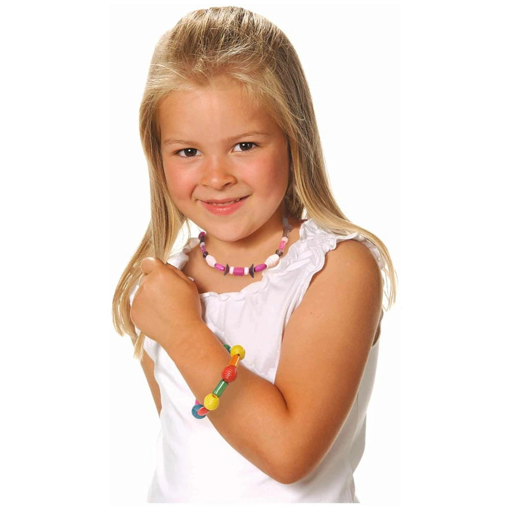 Eichhorn Wooden Bead Set - 275 colorful beads showcased on a smiling girl wearing a colorful beaded necklace.