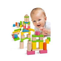 Eichhorn Wooden Blocks - 60 Pcs - A child plays with vibrant geometric toys on a white surface, smiling at the camera.
