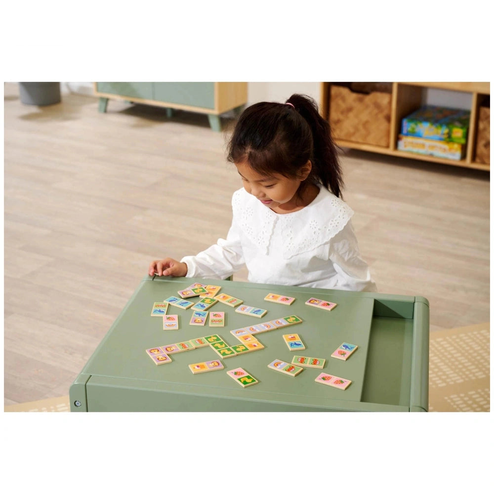 Eichhorn Wooden Domino Game featuring a young girl focused on colorful tiles at a child-friendly indoor setting.
