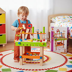 Eichhorn Work Bench set in a colorful playroom, where a child builds with wooden pieces and tools, igniting imaginative play.