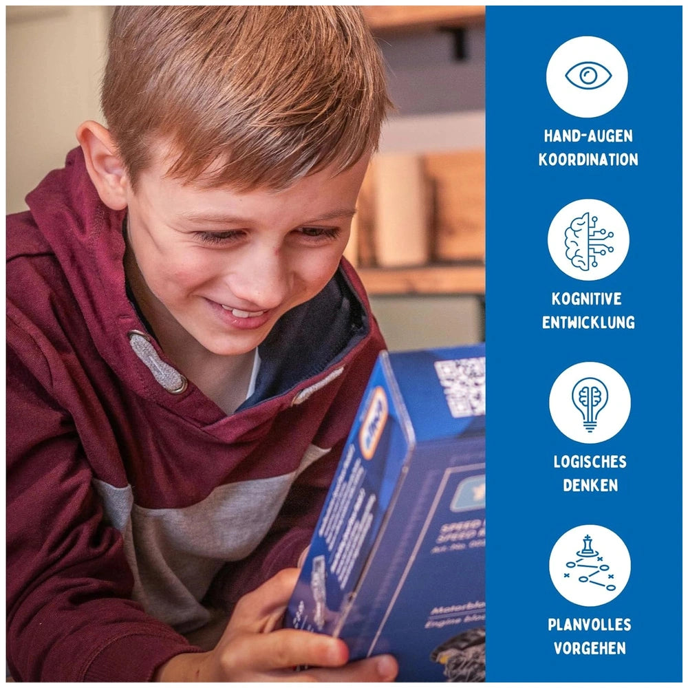 Eitech Rubin Rocket Racer green construction set held by a young boy in a red and gray hoodie with a blue cardboard box.