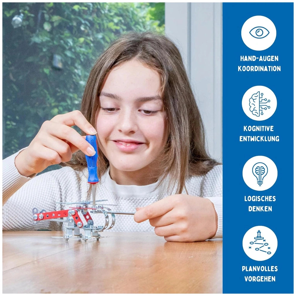Eitech Rubin Rocket Racer red construction set toy displayed on a wooden table, with a girl using a blue screwdriver on a hel