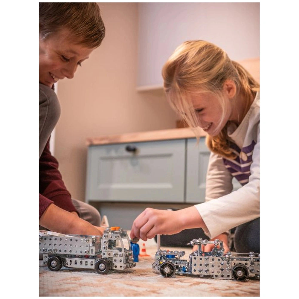 Eitech Speed Racer construction set with two children playing with silver and blue toy trucks featuring detailed components.